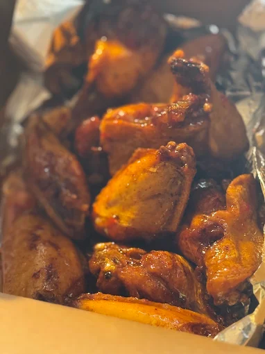 Chicken wings glazed in sauce from Asian Fusion